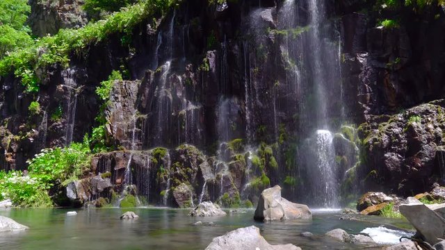 waterfall in a tropical forest on a sunny hot day. Georgia, waterfall Dashbashi.