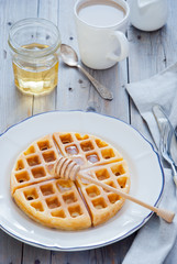 Homemade Waffles with organic honey for breakfast