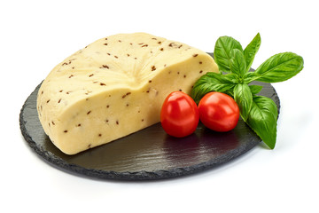 Sliced Cheese with cumin seeds on a stone plate, isolated on white background