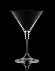 one crystal martini glass on a black background white contours