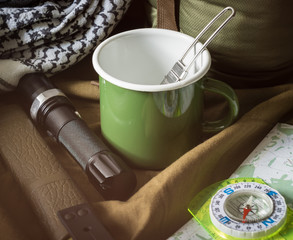 Bushcraft outdoor survival kit on rough canvas