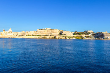 Fototapeta premium Scenic evening Valletta skyline view as seen from Manoel Island, Malta