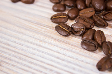 mockup of coffee beans on isolated wooden textured background