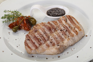 Grilled pork steak with pepper sauce