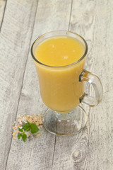 Dietary vegetarian oats milk over wooden