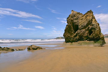 Beach with the big rock in the sea at Biarritz, a city on the Atlantic coast in the Pyrénées-Atlantiques department in the French Basque Country in southwestern France