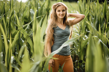 beautiful young girl walks through a corn field, woman portrait outdoors