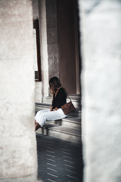Fototapeta Fashionably dressed woman on the streets