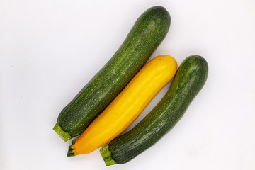 Zucchini Isolated on White Background. Fresh Organic Vegetarian Courgette Plant. Marrow Squash Raw Agriculture Food. Yellow and Green Ugly Organic Veggies Closeup. Delicious Garden Greenery
