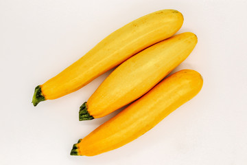Fototapeta na wymiar Yellow Zucchini Isolated on White. Raw Courgette Vegetable. Organic Marrow Squash for Spaghetti. Healthy Vegan Food. Ugly Organic Harvest. Natural Delicious Plant from Garden or Market