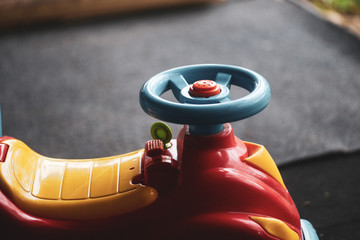Details of a colorful plastic children toy bike/car