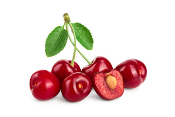 Some cherries with leaf and cut closeup isolated on white background