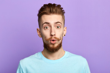 emotional man being amazed to see something, being shocked with terrified news or big sales in shoping mall.close up portrait. emotion and feeling. close up portrait.