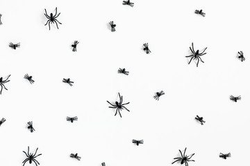 Fototapeta premium Halloween decorations concept. Halloween with spiders on white background. Flat lay, top view, copy space