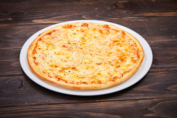 pizza on the wooden background