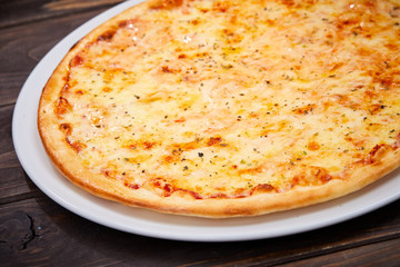 pizza on the wooden background