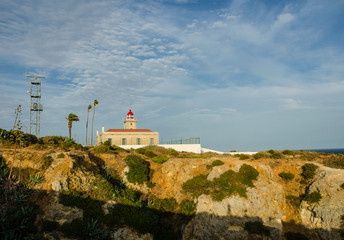 Fototapeta na wymiar The lighthouse near Ponta da Piedade, in Lagos, Western Algarve, Portugal.
