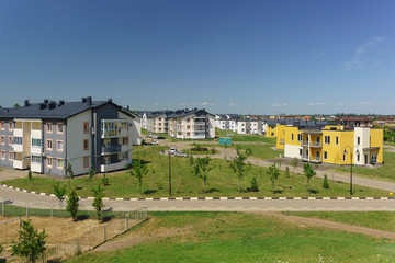 Fototapeta na wymiar Low-rise apartment buildings in the new district of Krasnodar on the street Schumann