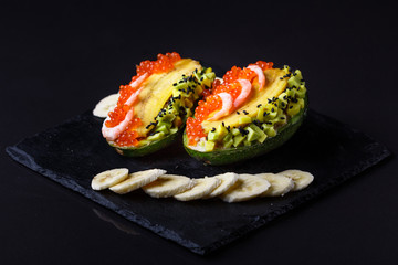 Avocado with banana caviar shrimp and canned tuna