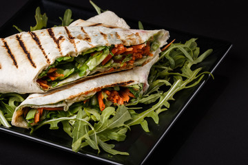 Vegetarian delicious pita with arugula and carrots