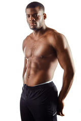 Fototapeta premium sporty awesome serious man with muscular body posing to the camera. close up portrait. isolated white background.