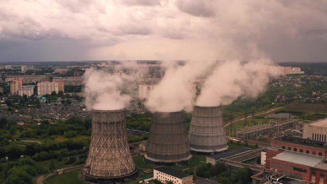 Smoke from chimneys of thermal power plant oe station, aerial view from drone