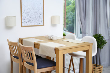 Modern room interior with wooden dining table
