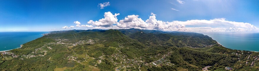Fototapeta na wymiar Air drone 360 view - on a mountain road near the village of Volkonka (South of Russia, the Caucasus) on a summer day. Not far away - the Black Sea