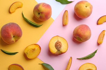 Flat lay composition with fresh peaches on color background