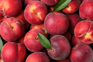 Delicious ripe peaches as background, top view