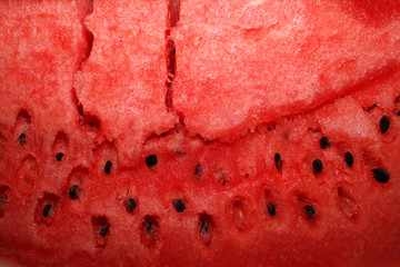 close up  view on fresh ripe juicy watermelon, red color background on the theme of diet and healthy eating