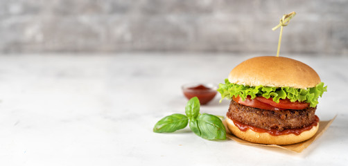 Homemade vegan burger on white rustic background