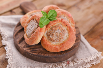 Baking with meat . High-calorie pastries for a delicious snack. Traditional pastries from Russia. Rustic homemade food.