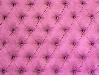 Background with pink upholstered old-fashioned furniture textile.