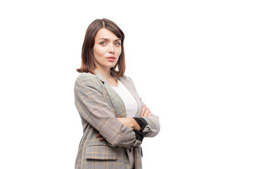 Young elegant secretary or teacher in suit crossing her arms on chest