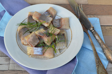 Healthy food concept. Slices of salted herring. Delicious lunch.