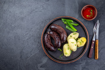 Spanish and Argentine MORCILLA blood sausages with potatoes and chile sauce