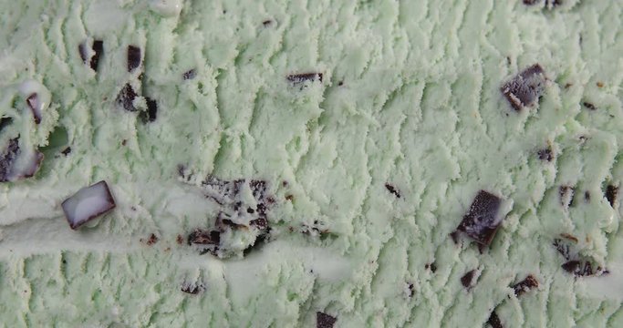 Top view of mint flavour ice cream with chocolate flakes in box 4k