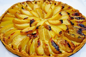 Homemade fruit tart with plums and frangipane almond cream
