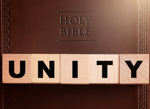 Unity Spelled in Blocks on a Leather Holy Bible