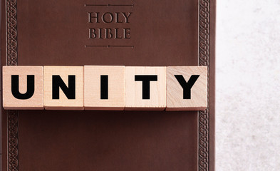 Unity Spelled in Blocks on a Leather Holy Bible