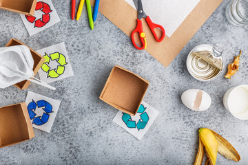 Kids hands is making recycling game kid is drawing recycle sign paper craft