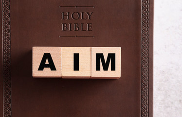 Aim spelled in Blocks on a Leather Bible