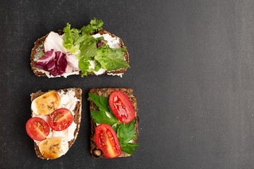 Variants of traditional Danish open sandwiches on rye bread for breakfast