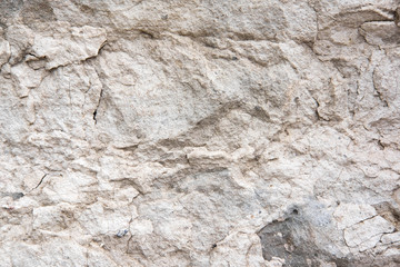 The texture of a light stone wall that partially collapses. Background for the banner. The basis for design