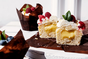 Berry cupcakes with filling, cut. Dessert for birthday, wedding, celebration. Decoration in...