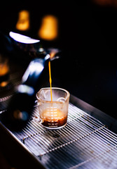 glass of espresso on black background