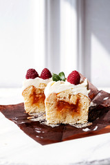 Berry cupcakes with filling, cut. Dessert for birthday, wedding, celebration. Decoration in chocolate tone.