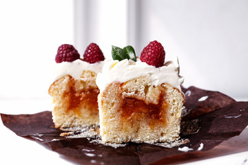 Berry cupcakes with filling, cut. Dessert for birthday, wedding, celebration. Decoration in chocolate tone.