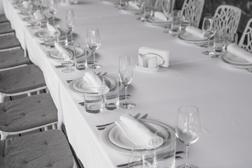 White banquet table setting. Serving for one person. Banquet table
